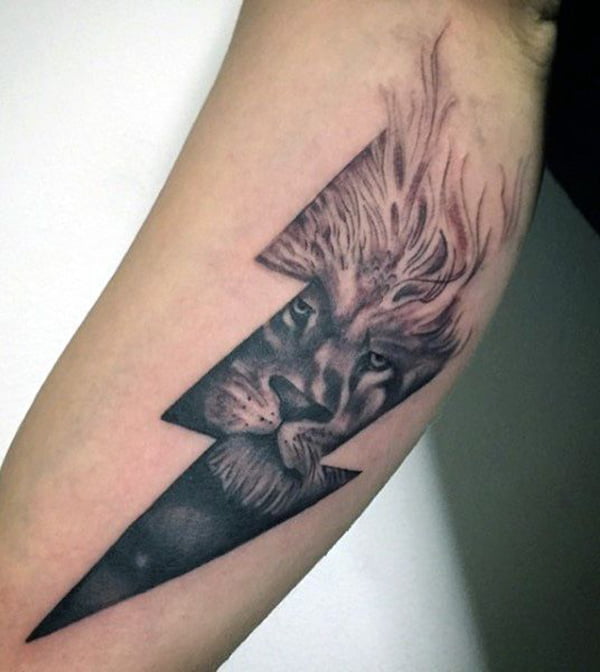 Lion Face Within a Lightning Bolt Bicep Tattoo Ideas