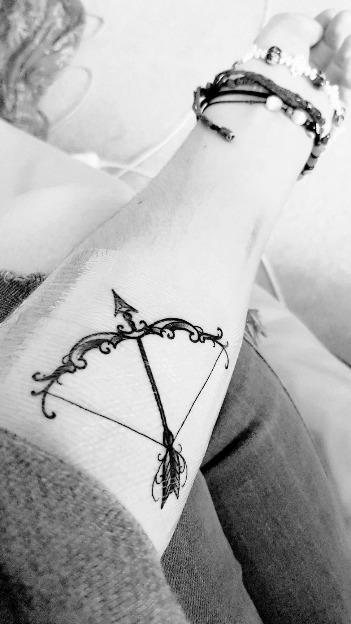 Getting Abstract Arrow Tattoo with an Arrow and Bow