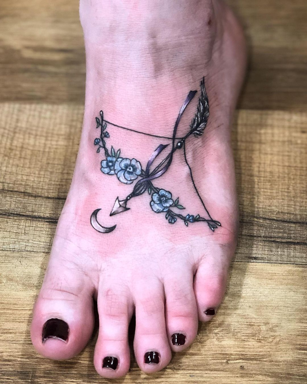 Lovely in Lilies Black Female Archer Tattoo