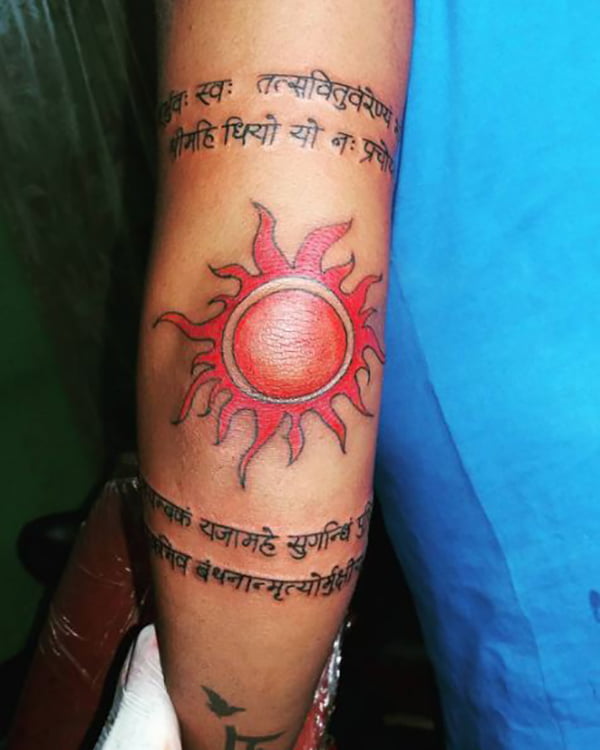Orange Sun with Text Above and Below Elbow Tattoos