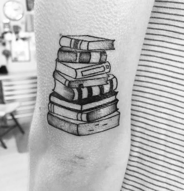 Tall Stack of Hardcover Books Elbow Tattoos