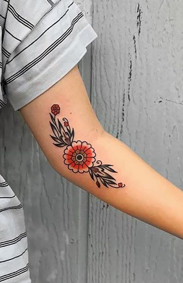 Stylized Orange Flower with Leaves Elbow Tattoos