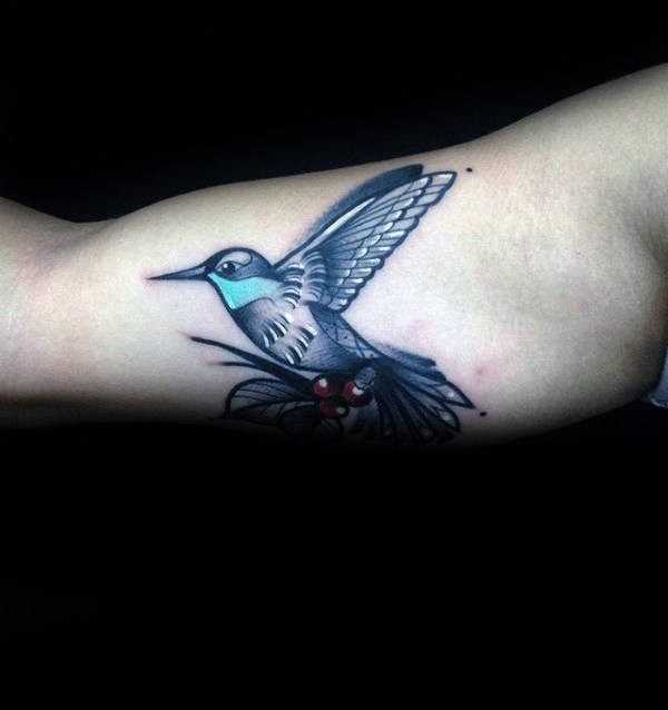Stylized Blue and White Hummingbird Bicep Tattoo