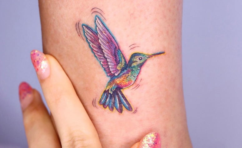 Cartoon-Style Rainbow Hummingbird Tattoo Thrumming with Motion