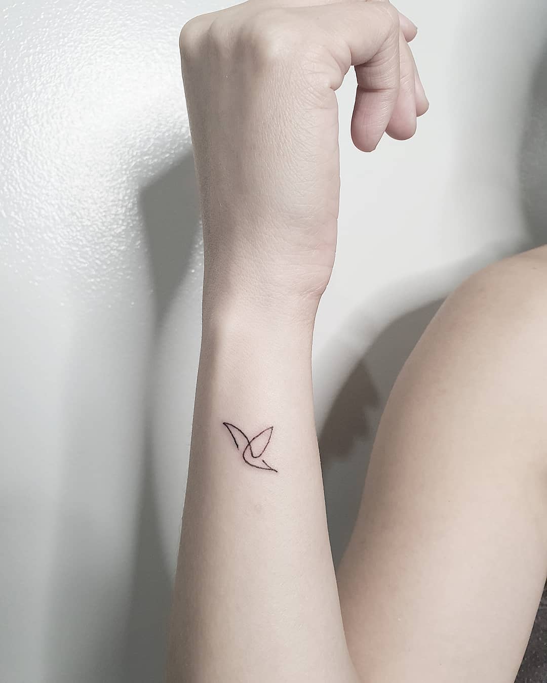 Minimalist, Single-Line, Colorful Hummingbird Tattoo on Arm