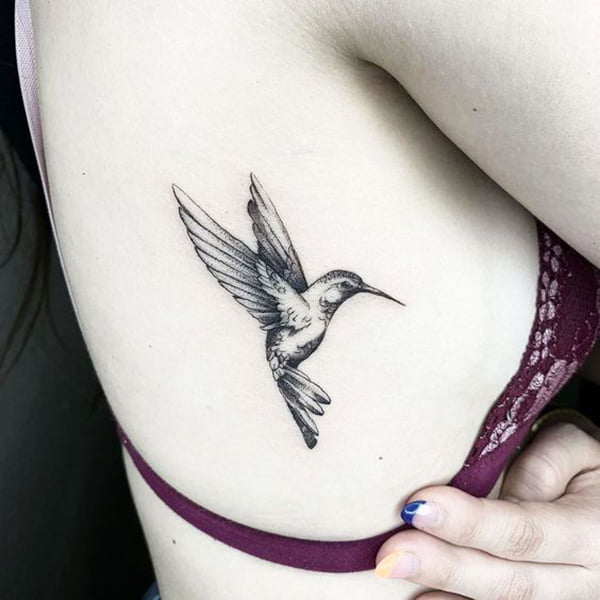 Determined Small Hummingbird Tattoo Design on Ribcage