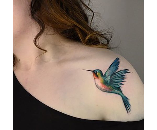 Cheerfully Colored Hummingbird Tattoo on Shoulder from Tattoo Artist