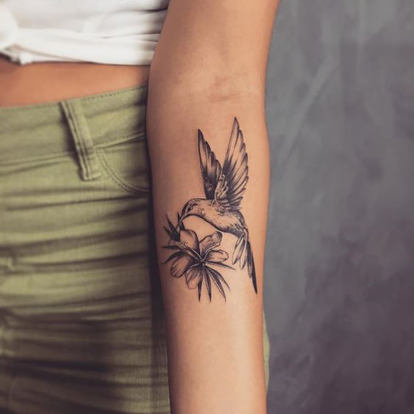 Graceful Jamaican Hummingbird Tattoo with Tropical Flower