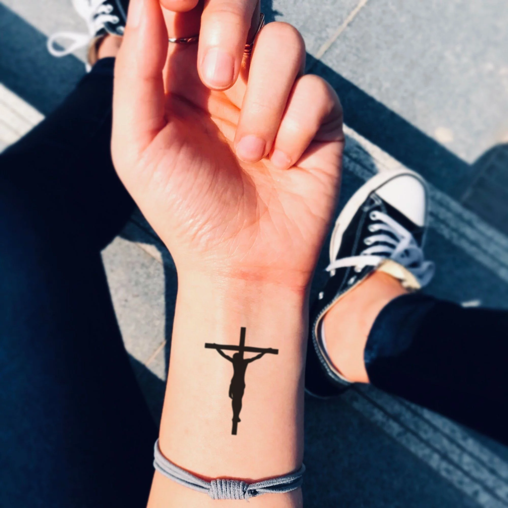 Attractive Small Cross Tattoo On Left Wrist