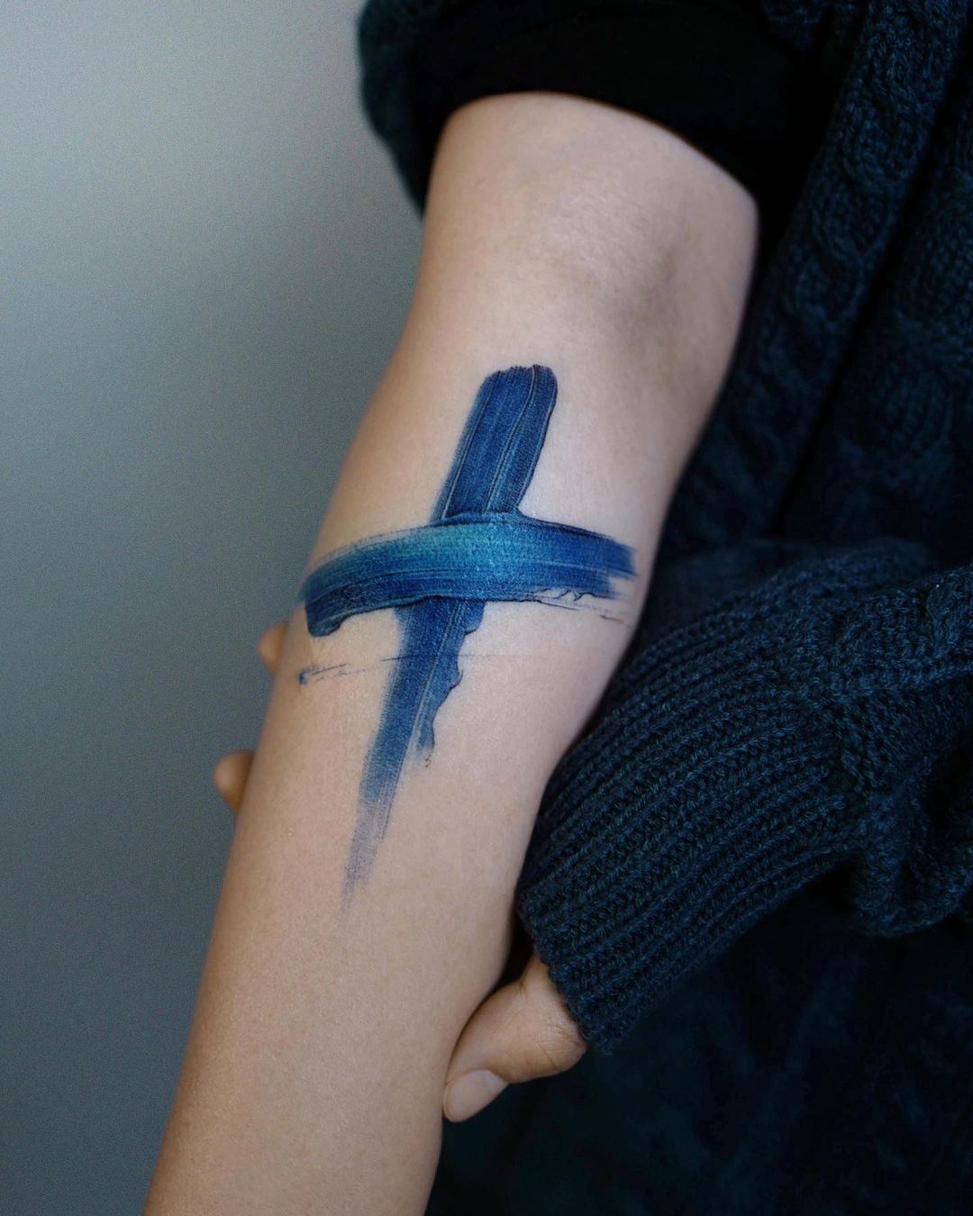 Blue Painted Cross Tattoo with a Faded Base, Cross Tattoos