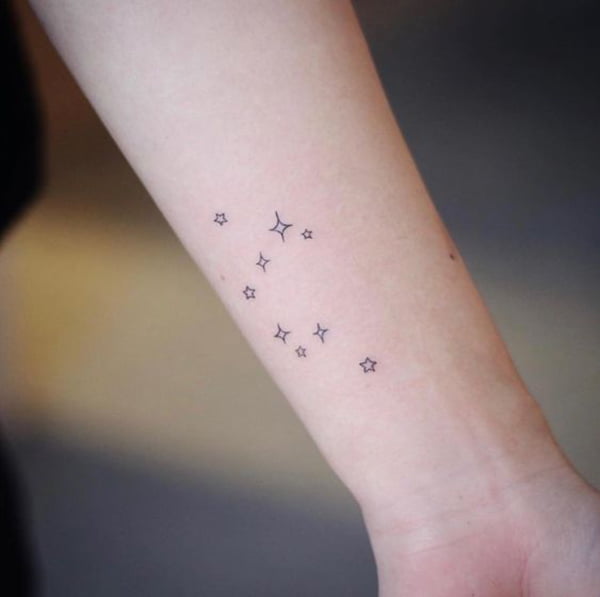 Cluster of Four and Five-Pointed Nautical Star Tattoo