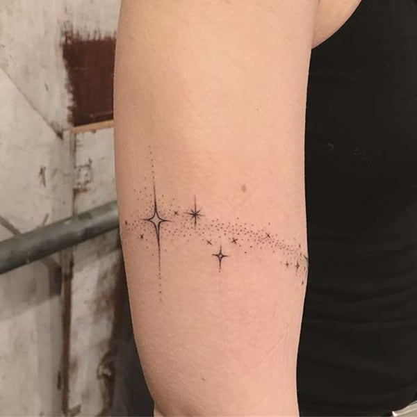 Trail of Small Star Tattoo Across Bicep